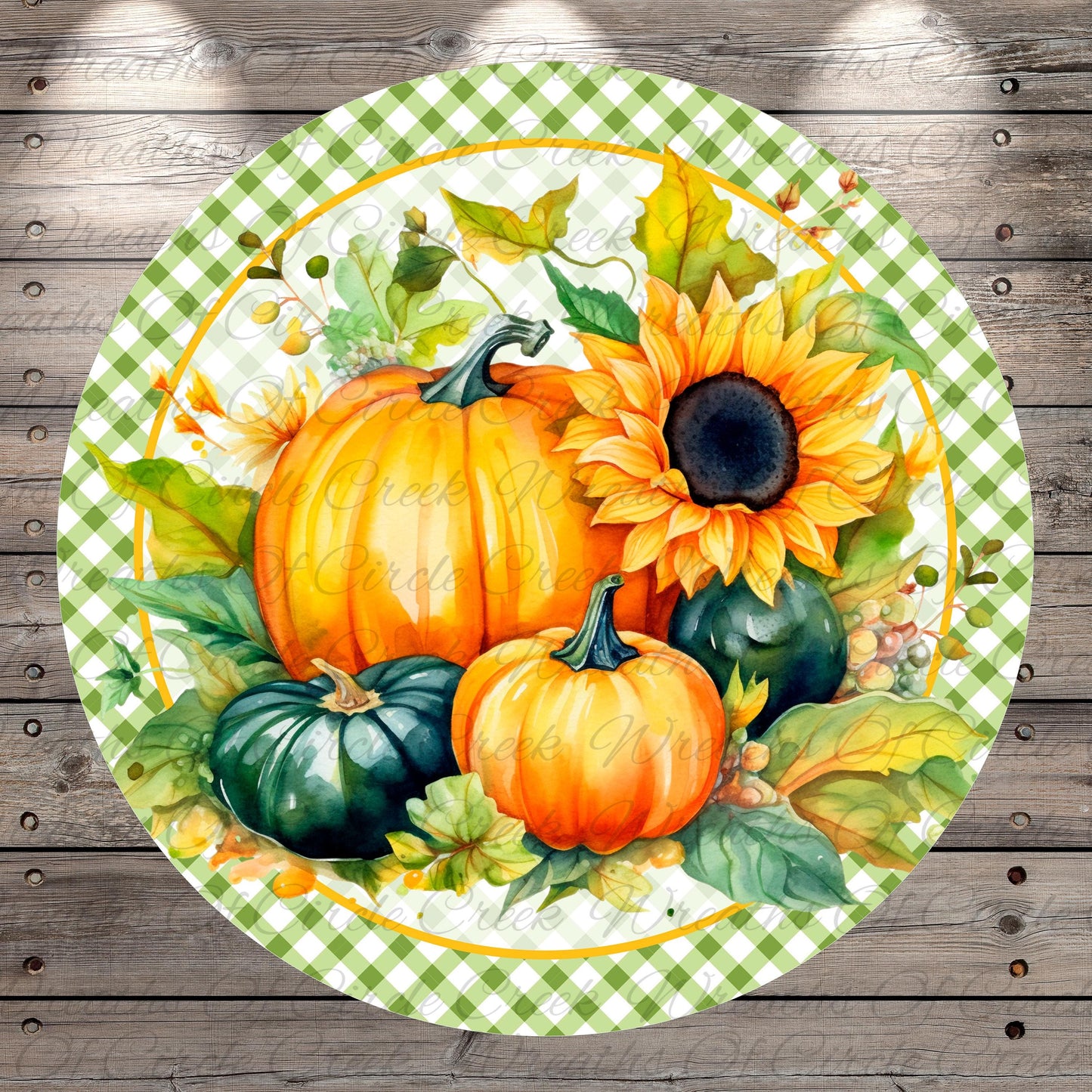 A round, green and white checkered plate with a vibrant arrangement of autumn-themed pumpkins and a sunflower on it, set against a rustic wooden background.