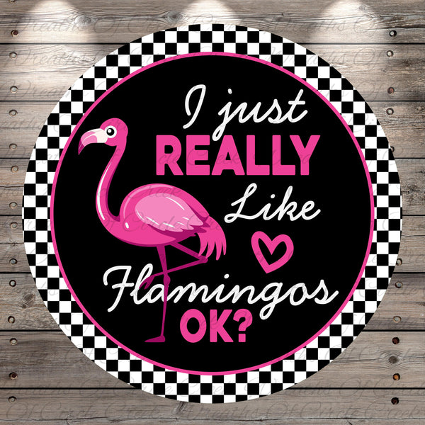 A circular sign with a pink flamingo and the text "I just really like flamingos" in pink and black.