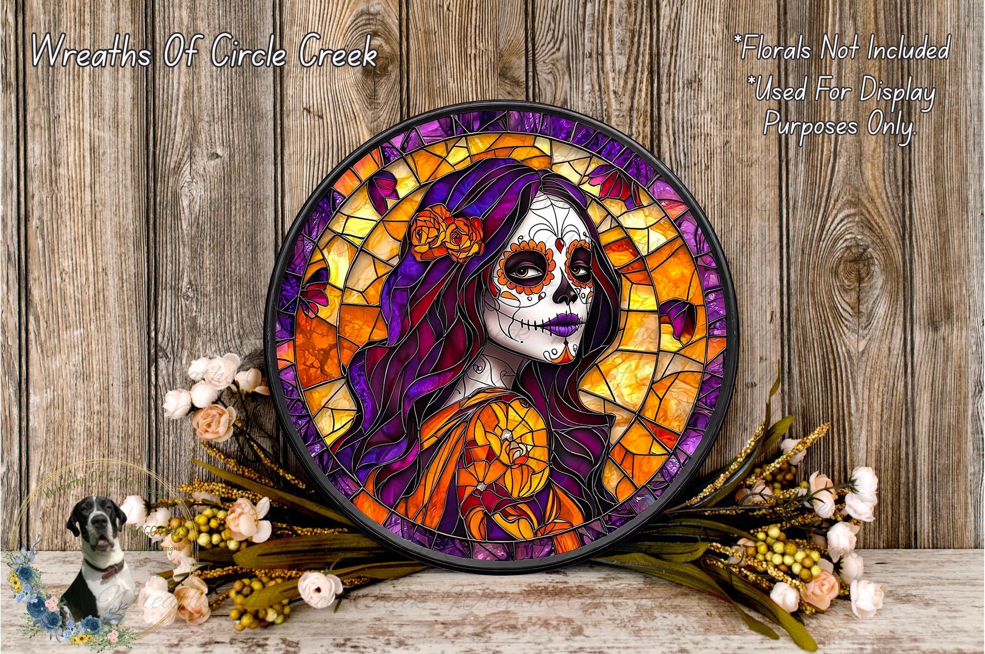 a colorful stained glass portrait of a woman with a skull-like face, surrounded by flowers and placed on a wooden surface.