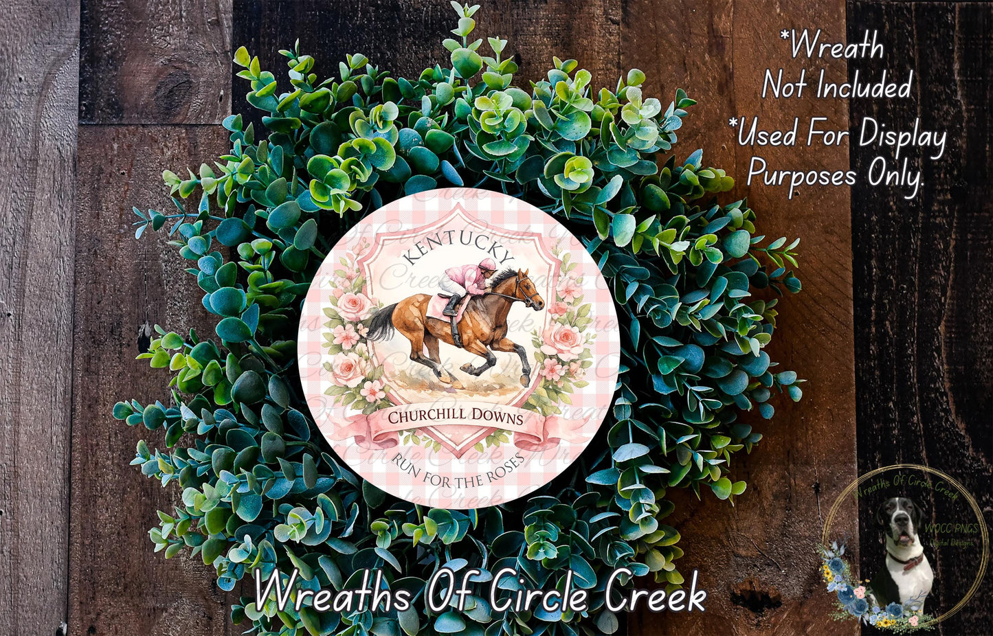 a wreath made of green foliage and a circular design with a horse and rider, surrounded by text that reads "Kentucky Churchill Downs run for the roses".