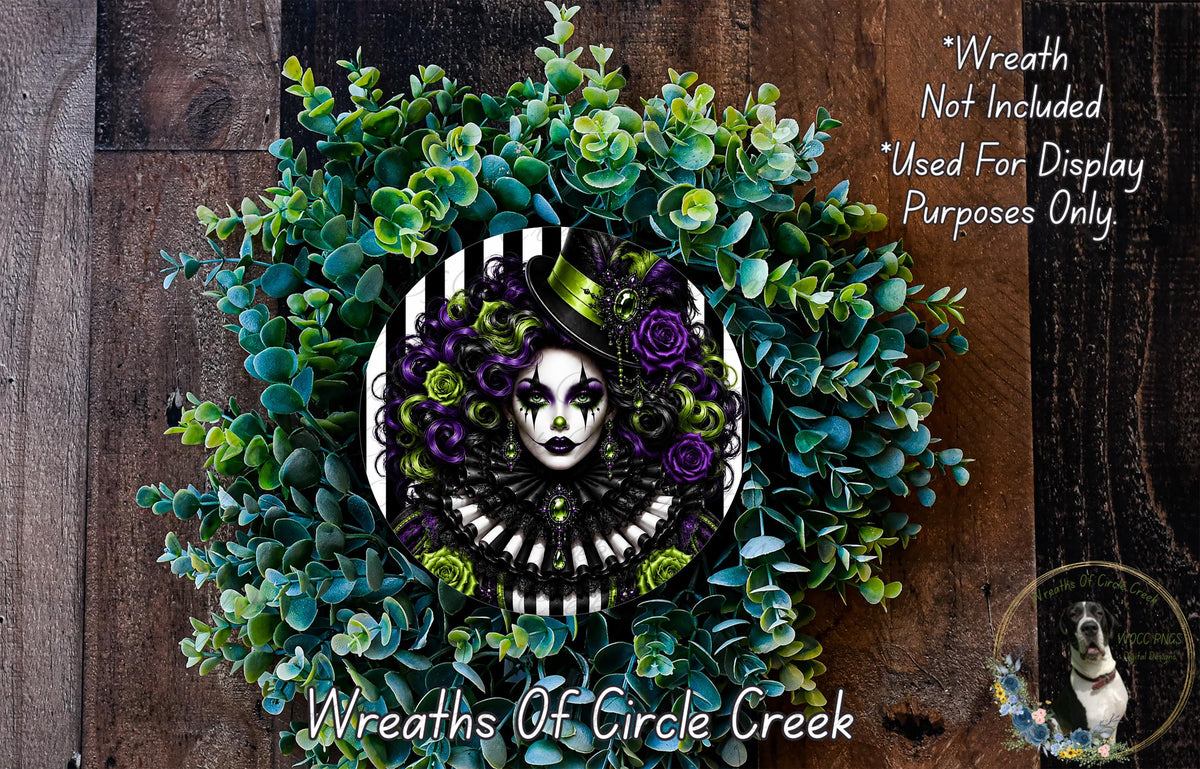 a wreath with a woman's face as the central design element, surrounded by a lush arrangement of green and purple foliage.