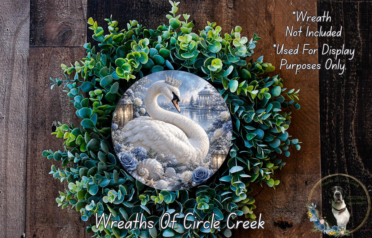 A wreath made of green leaves and a white swan, with a circular image of a snowy landscape in the center.