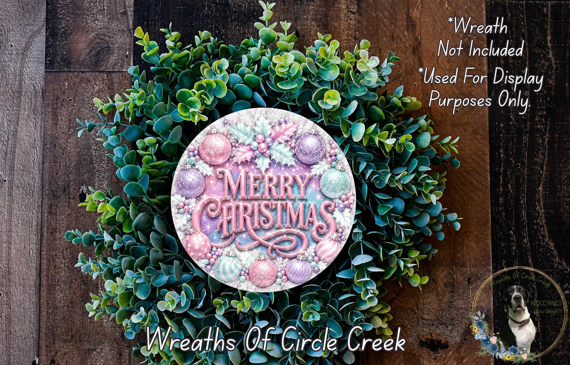 A wreath made of green leaves and colorful ornaments, with the text "Merry Christmas" displayed on it.