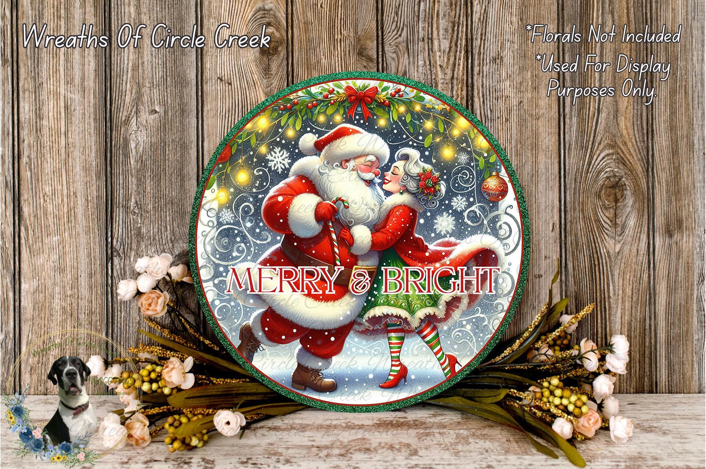 A festive Christmas wreath with a Santa Claus and a woman, surrounded by flowers and greenery, with the text "MERRY & BRIGHT" displayed on the wreath.