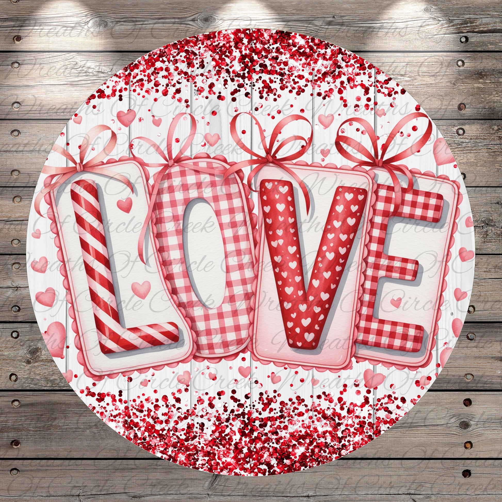 A circular design featuring the word "LOVE" in a decorative font, surrounded by red and white polka dots and ribbons.