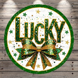 a circular design with the word "Lucky" prominently displayed in the center, surrounded by a green and gold bow and a scattering of stars.