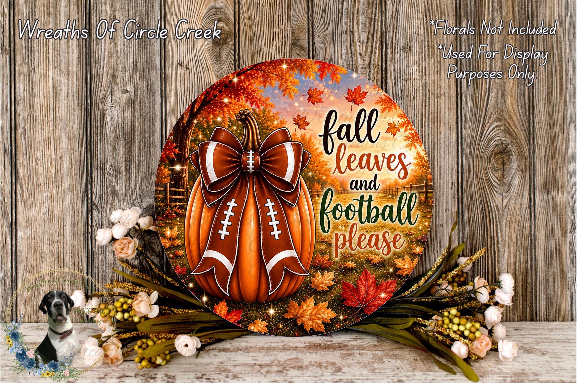 a decorative wreath with a football design, surrounded by fall leaves and flowers, with the text "fall leaves and football please" displayed on it.