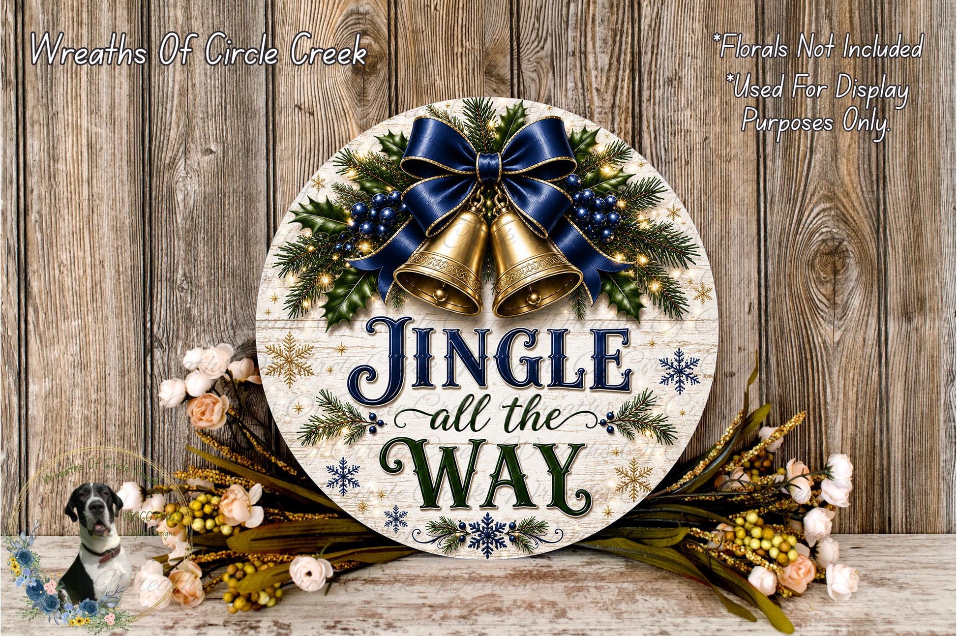A festive wreath with a jingle bell design, surrounded by flowers and greenery, with the text "Jingle all the way" displayed on it.