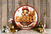 A circular sign with the word "GOBBLE" in large letters, surrounded by a decorative arrangement of autumn leaves, flowers, and a bird.