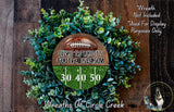 a wreath made of green foliage and a football, with text and numbers displayed on it.