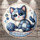 A round, decorative image featuring a blue and white cat sitting on a wooden surface, surrounded by various sewing-related elements such as buttons and yarn.