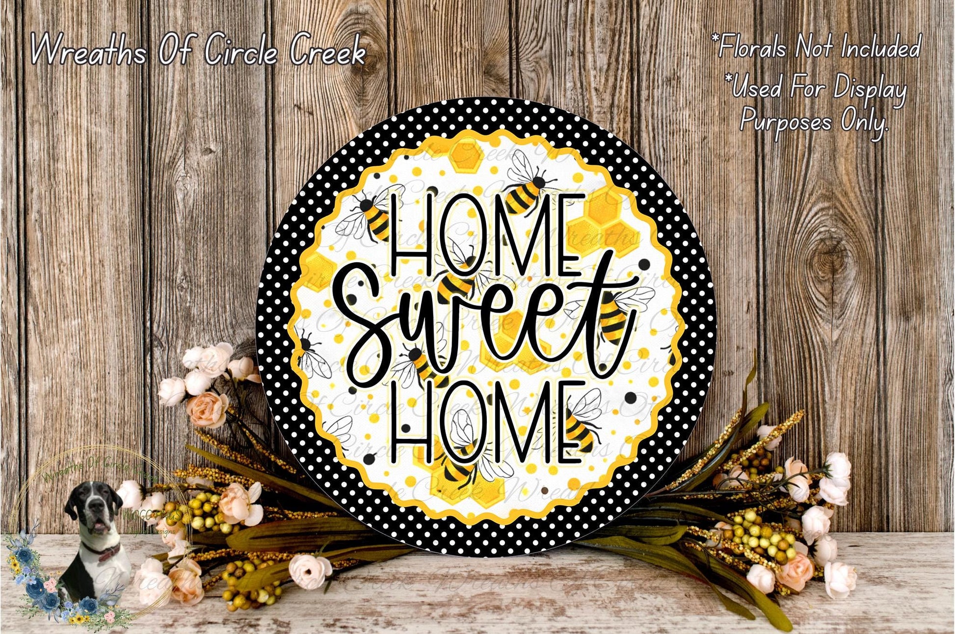 A decorative sign with the text "HOME SWEET HOME" surrounded by a floral arrangement and a wooden background.