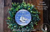 A wreath made of green leaves and a pair of white skis, with the text "Winter Wonderland" and "Wreaths of Circle Creek" displayed on it.