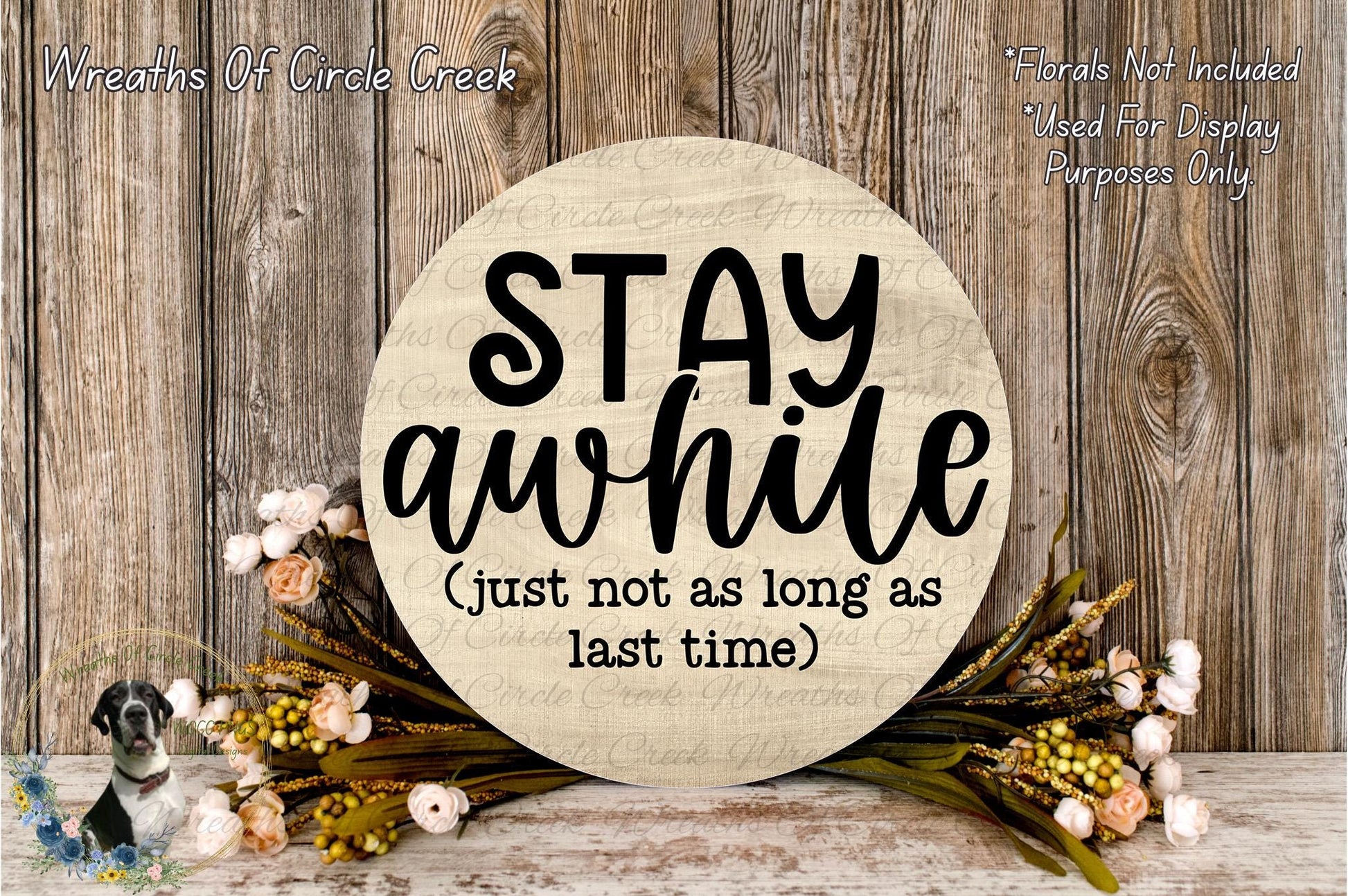 a wooden sign with the text "STAY A while [Just not as long as last time]" surrounded by flowers and greenery.