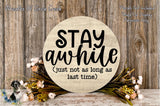 a wooden sign with the text "STAY A while [Just not as long as last time]" surrounded by flowers and greenery.