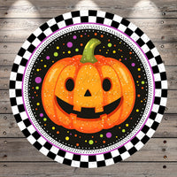 A cheerful jack-o-lantern with a smiling face is surrounded by a checkered border and colorful dots against a black background.