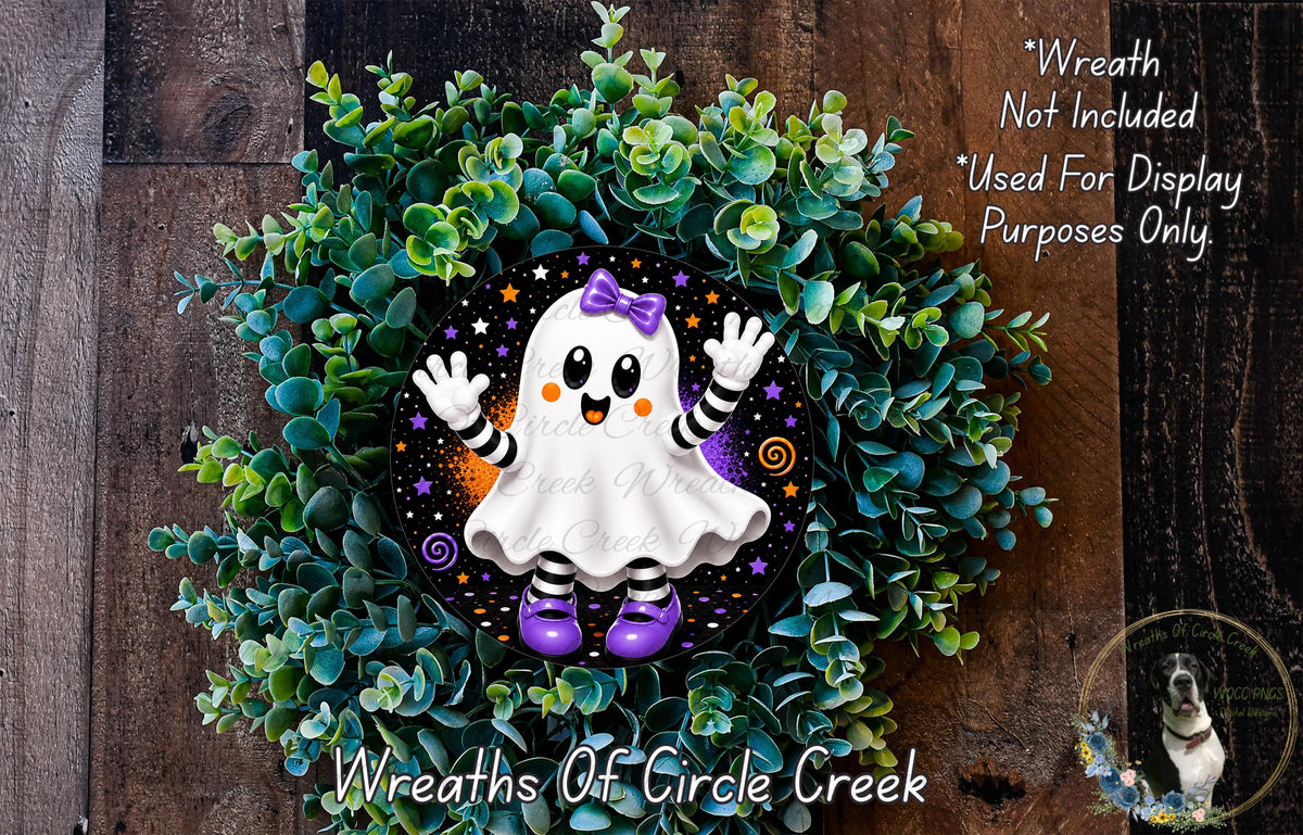 A wreath made of green foliage and featuring a ghost character with purple shoes and a bow, placed on a wooden surface.
