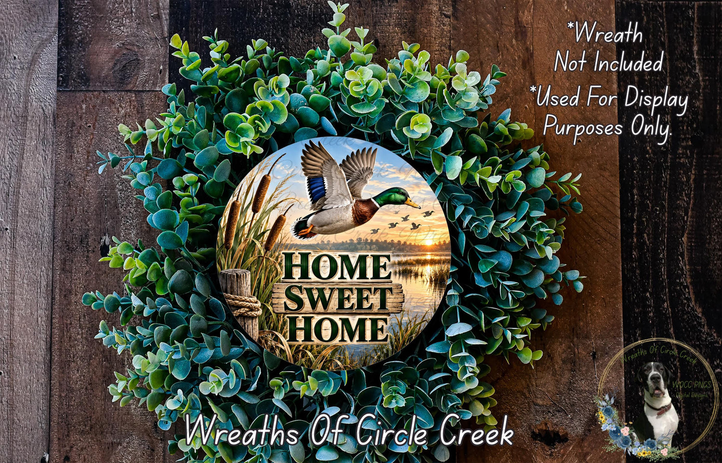 a wreath with a bird in flight and the text "HOME SWEET HOME" displayed on it. The wreath is surrounded by greenery and placed on a wooden surface.