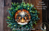 A wreath made of green leaves and branches, featuring two cartoon cows sitting around a campfire. The wreath is displayed on a wooden surface, and there is a text overlay that reads "Wreath Not Included * Used For Display Purposes Only".