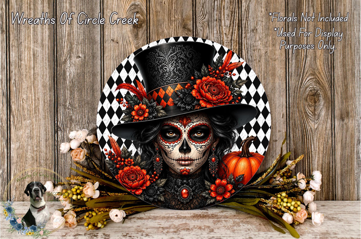 a decorative wreath with a sugar skull design, surrounded by various floral elements such as roses, pumpkins, and other autumn-themed decorations.