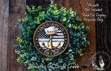a wreath made of green foliage and a navy seal emblem, with the text "Proud Graduate NAVY" and "PIR 2005" displayed on it.
