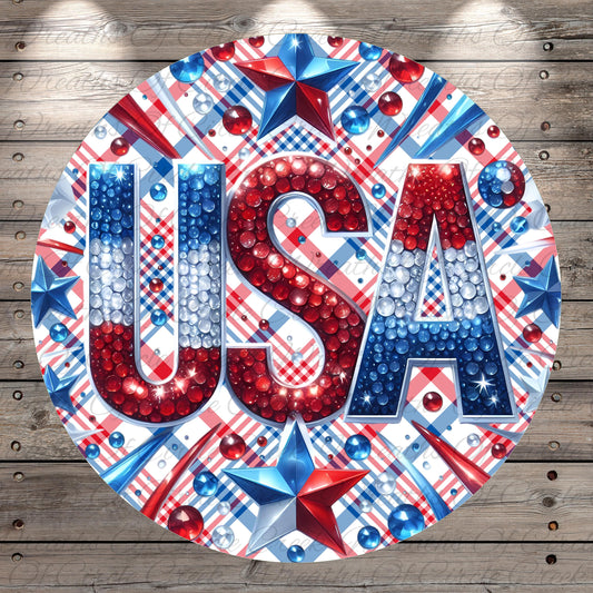 a circular design with the word "USA" prominently displayed in the center. The design is adorned with various patriotic symbols, such as stars, stripes, and beads in red, white, and blue colors. The overall design is visually striking and patriotic, reflecting the spirit of the United States.