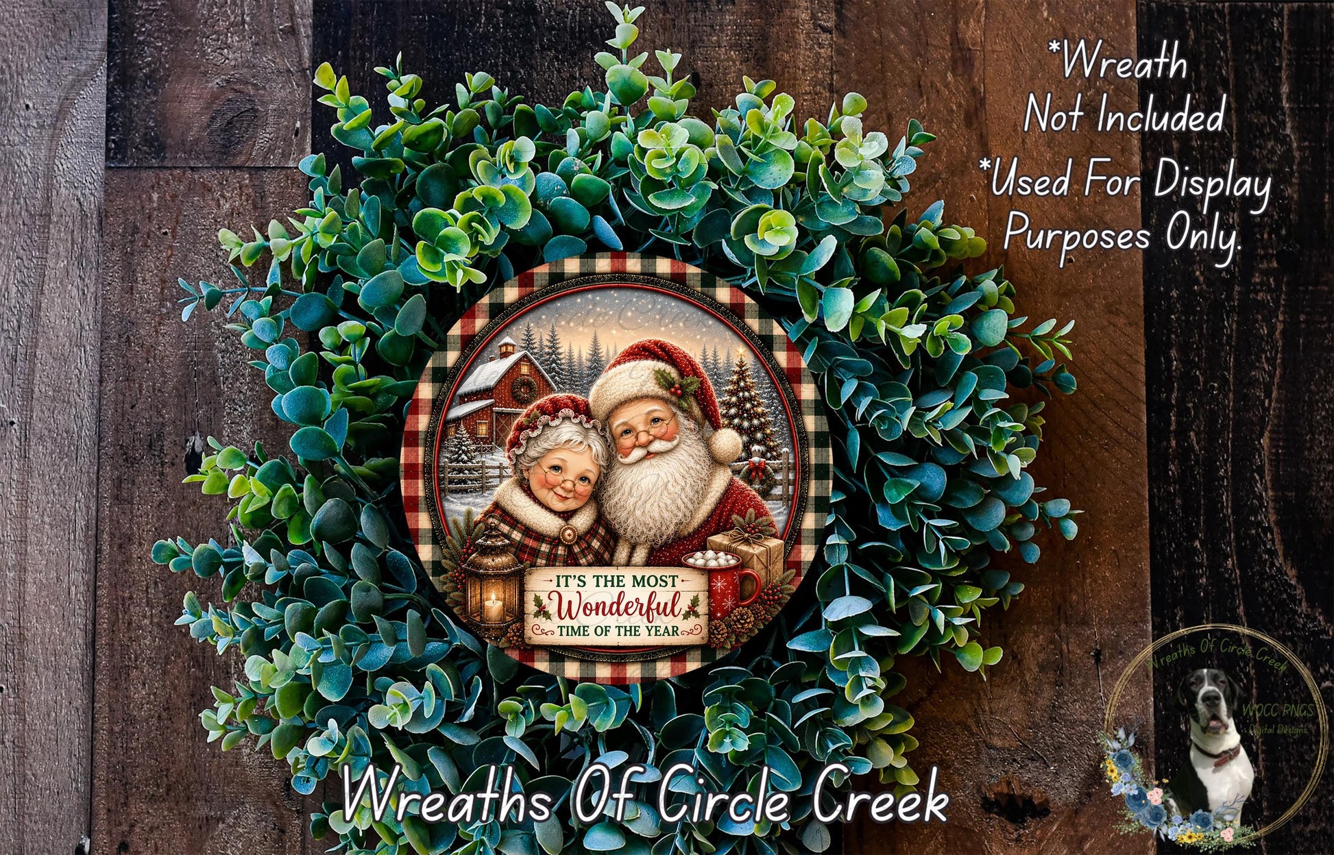 A wreath made of green foliage, featuring a Santa Claus and Granny Claus illustration, with the text "It's the most wonderful time of the year" and "It's the wreath of the season" written on it.