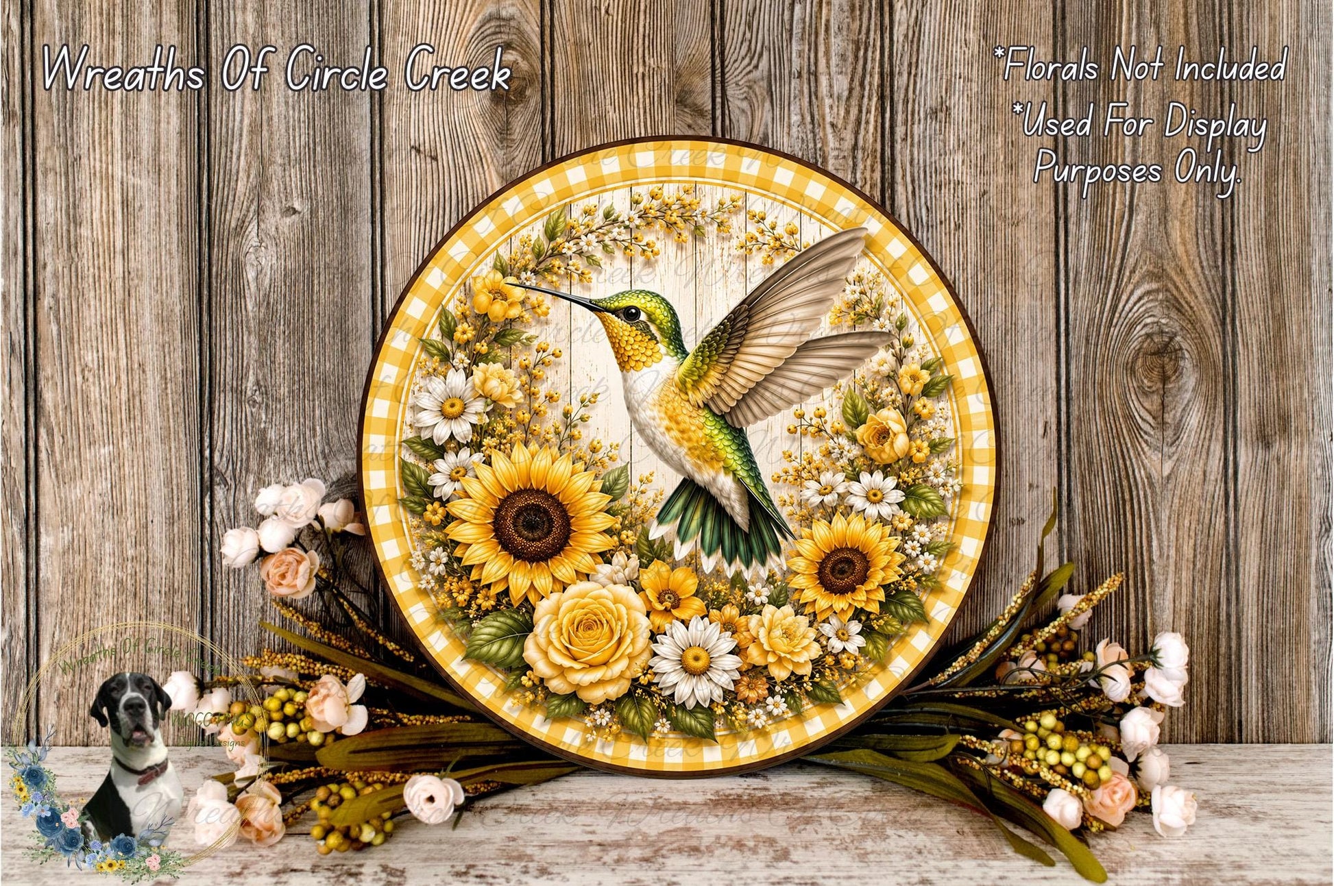 A decorative plate featuring a colorful hummingbird surrounded by flowers, placed on a wooden surface.