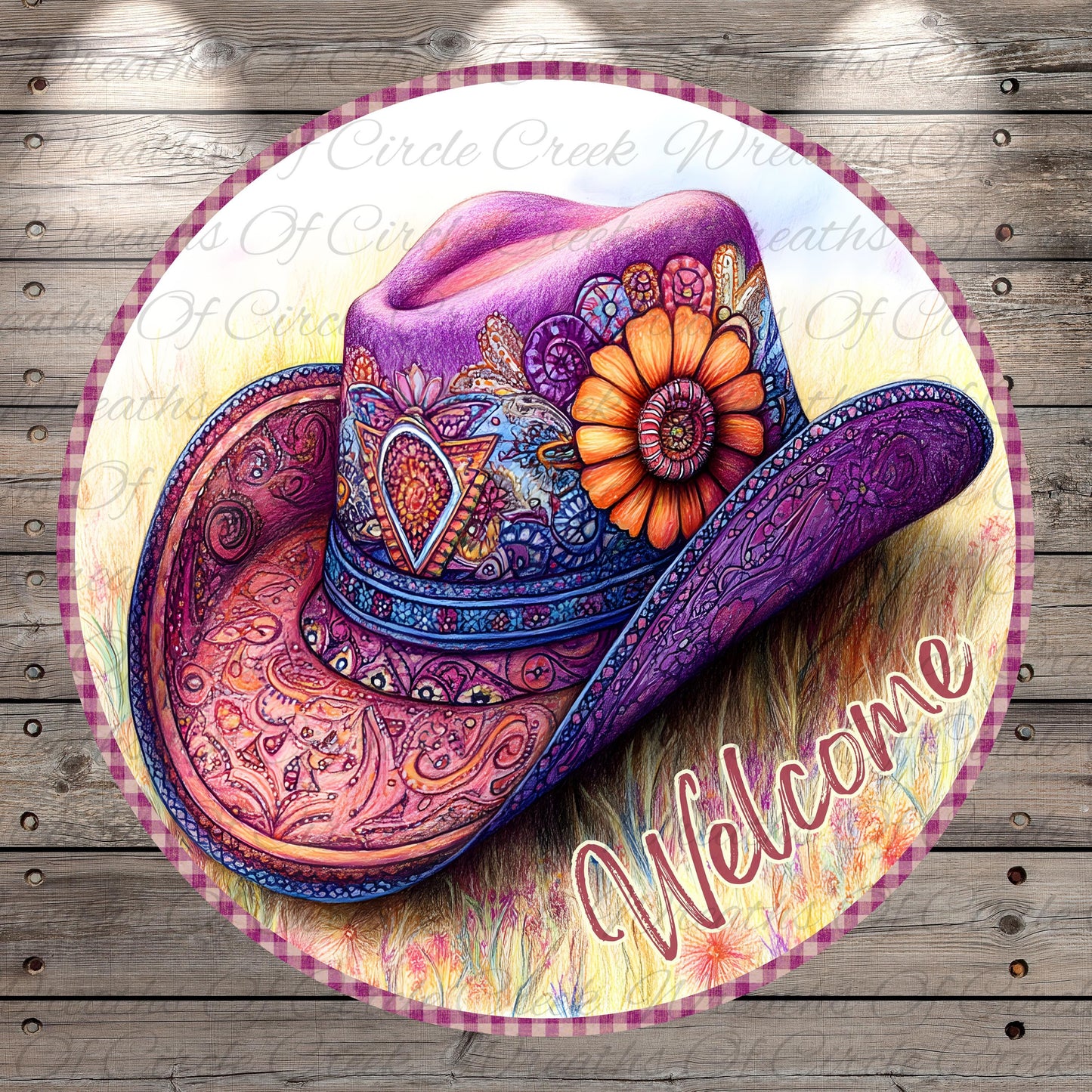 A colorful, intricately decorated cowboy hat with a flower on the side, placed on a circular sign with the word "Welcome" written on it.