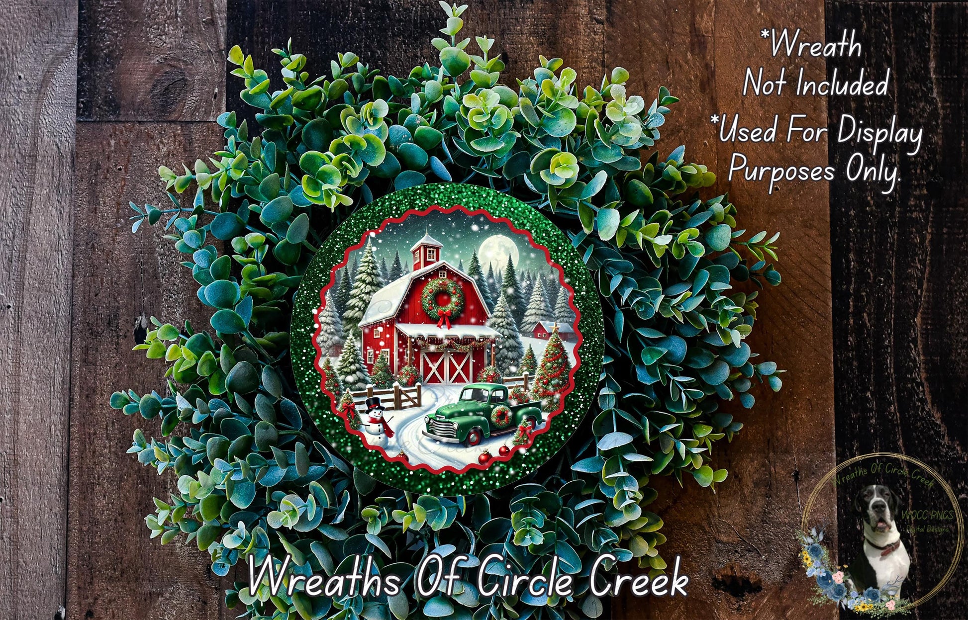 A wreath with a red barn and Christmas trees, surrounded by greenery, with a small image of a truck in the center.