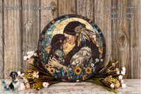 a large circular mosaic artwork depicting a woman and a child, surrounded by flowers and greenery, placed on a wooden surface.