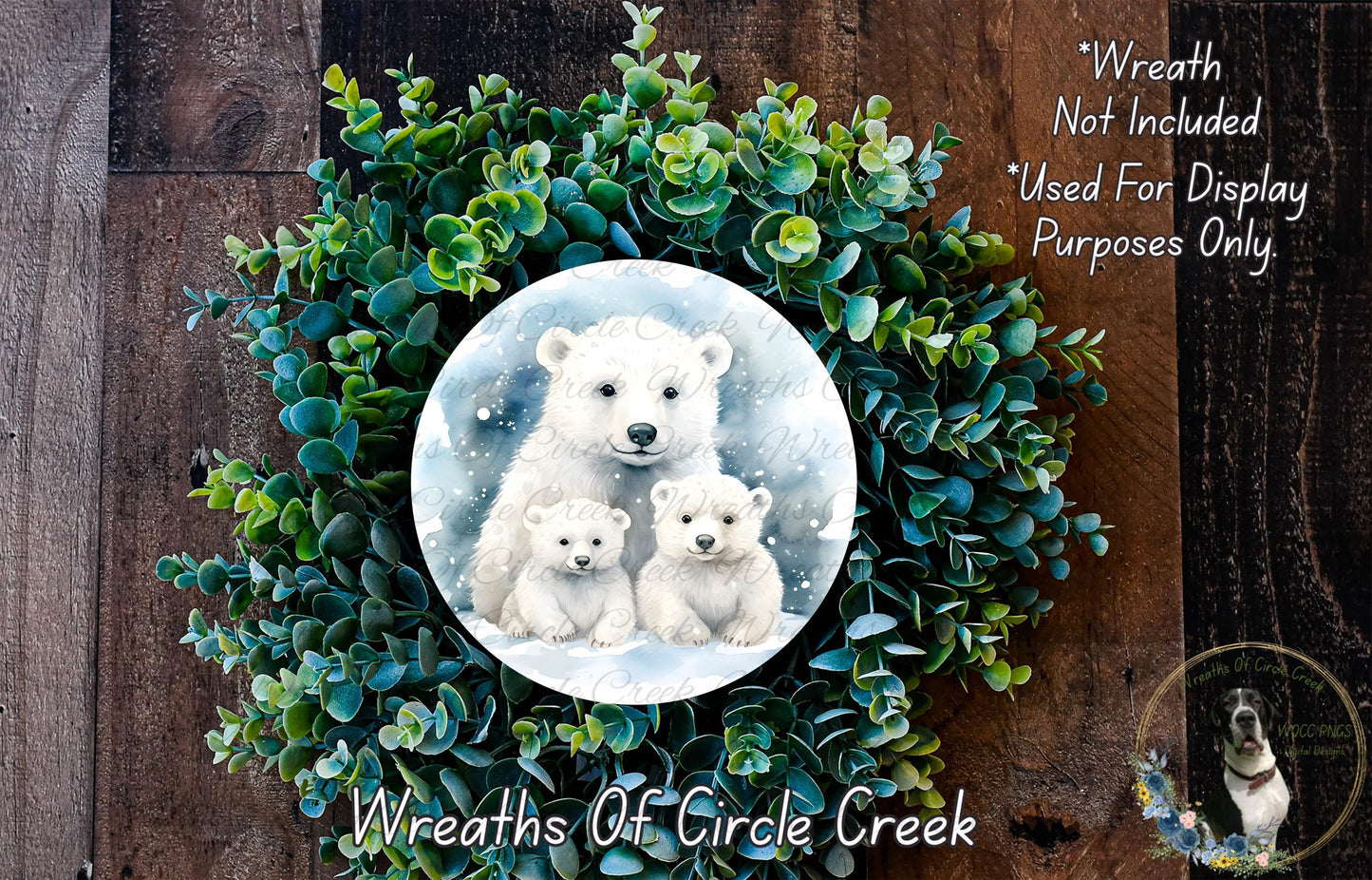 A wreath made of green leaves and a white bear image, with a caption that reads "Wreath Not Included * Used For Display Purposes Only".