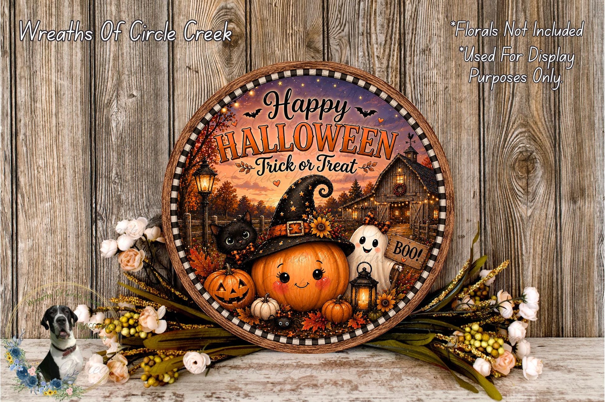 A Halloween-themed wreath with a pumpkin, ghost, and other spooky elements, surrounded by flowers and placed on a wooden surface.