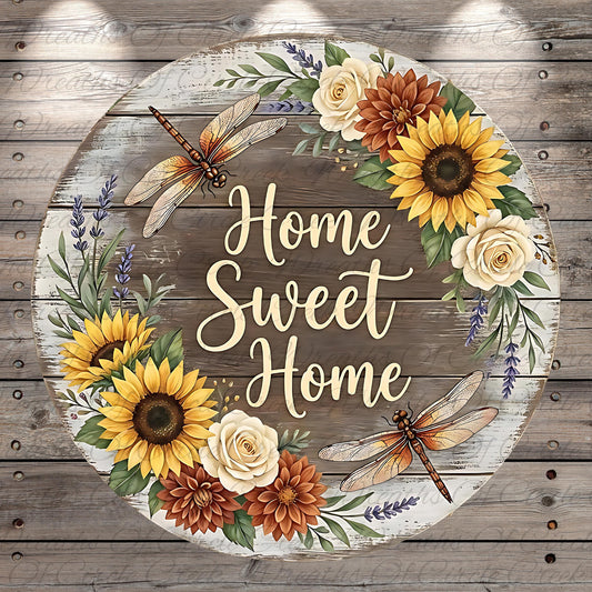 A round wooden sign with a floral wreath around it, featuring sunflowers, roses, and dragonflies. The sign has the text "Home Sweet Home" written on it.