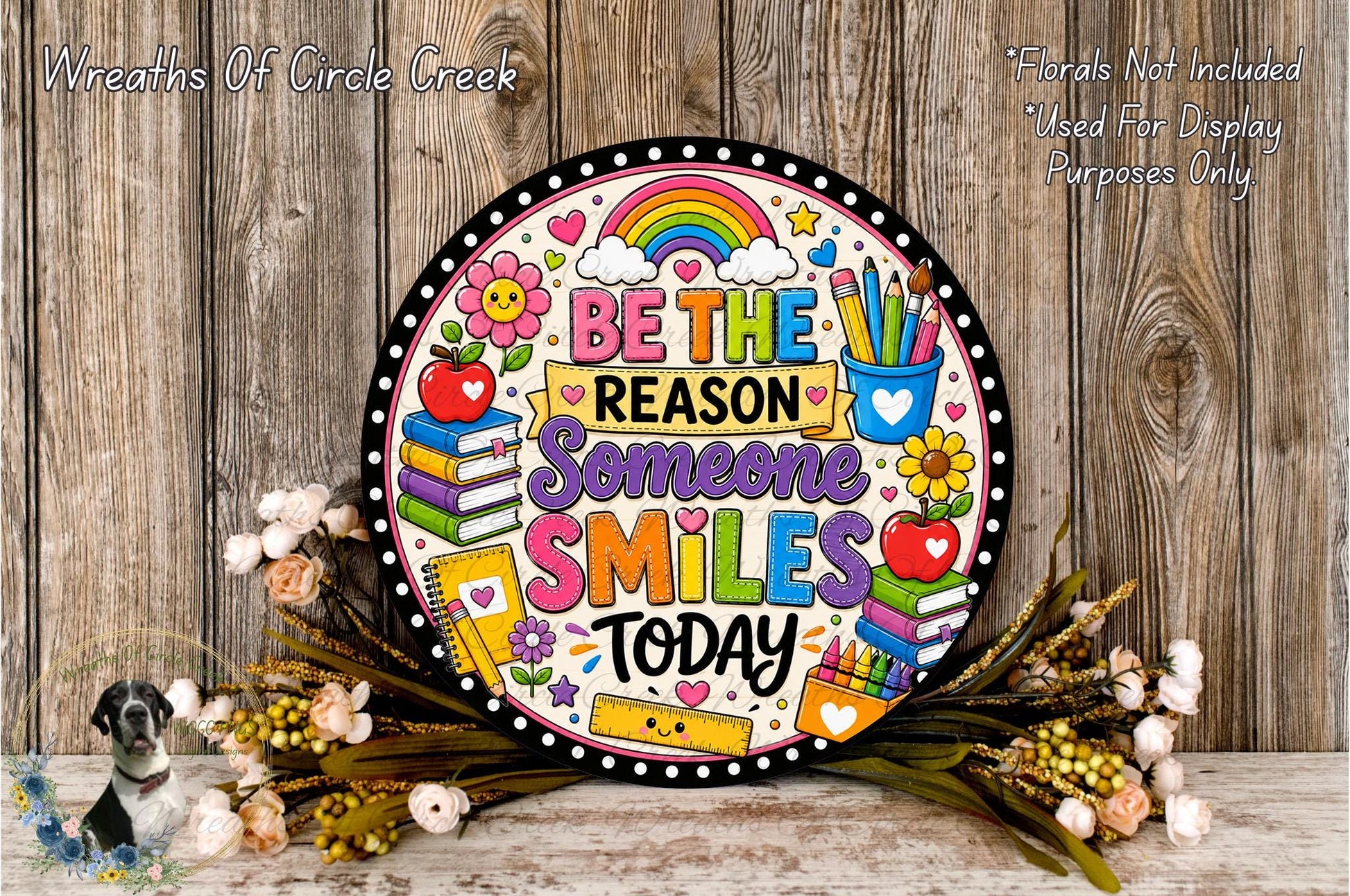 a colorful, hand-painted sign with a message about being kind and considerate, surrounded by flowers and a wooden background.