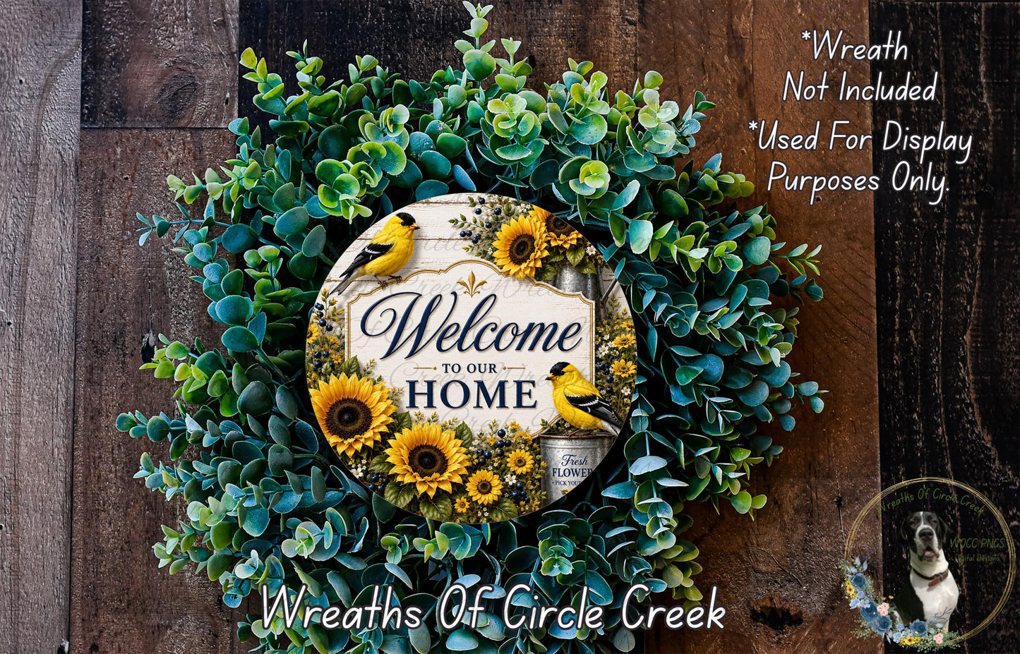 a wreath with a sign that says "Welcome to our Home" surrounded by various greenery and sunflowers.