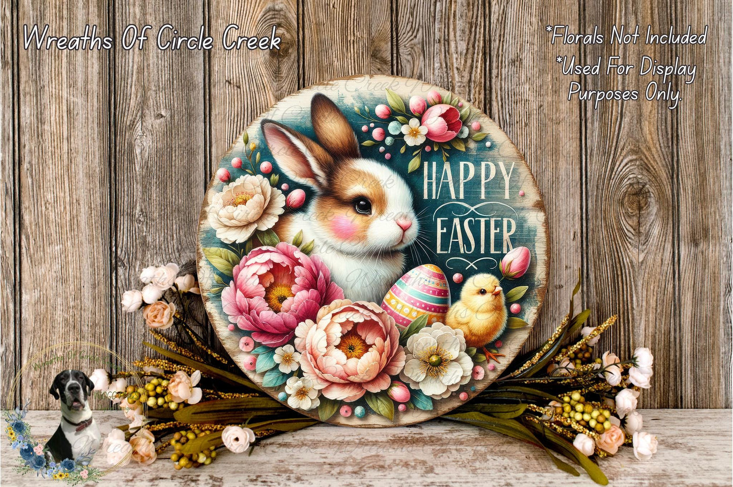 A decorative Easter wreath featuring a bunny and a chicken surrounded by colorful flowers and greenery, with the text "Happy Easter" displayed on the wreath.