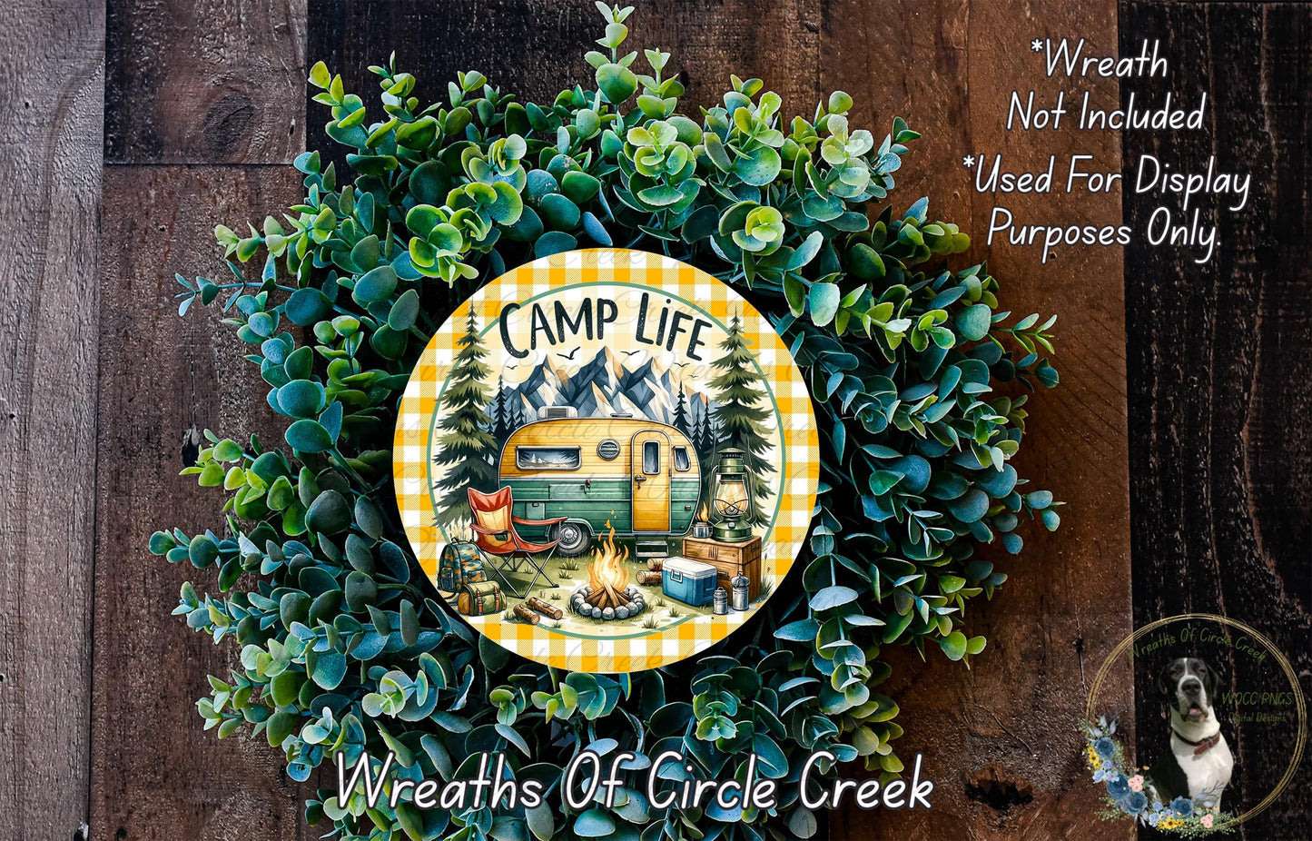 A wreath made of green foliage and featuring a yellow and green RV design, with the text "CAMP LIFE" and "Weights of Circle Creek" printed on it.