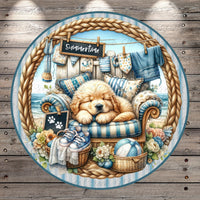 A golden retriever puppy is peacefully sleeping on a blue and white striped chair, surrounded by various summer-themed items such as a blue and white striped towel, a blue and white striped pillow, and a blue and white striped blanket.