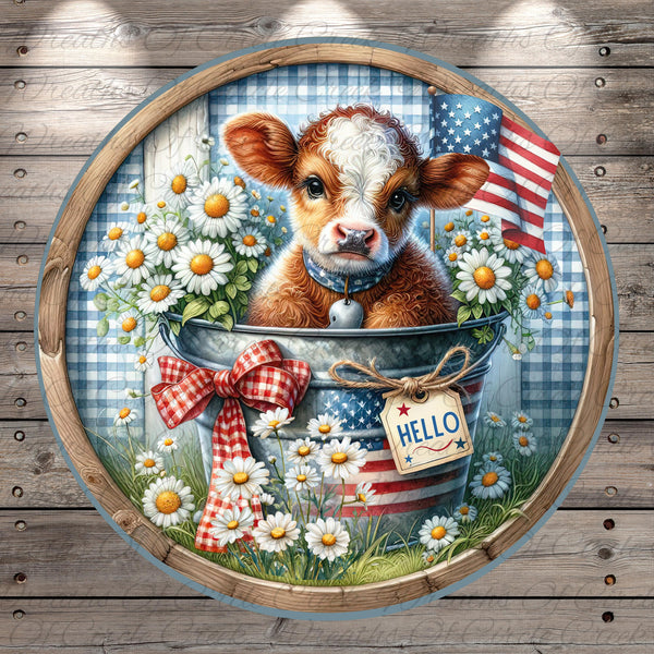 A cow is sitting in a bucket filled with flowers, surrounded by a patriotic American flag and a "Hello" sign.