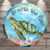 A watercolor painting of a green sea turtle swimming in the ocean, surrounded by colorful coral and marine life. The text "go with the flow" is written around the turtle, and the background is a blue watercolor with a white border.