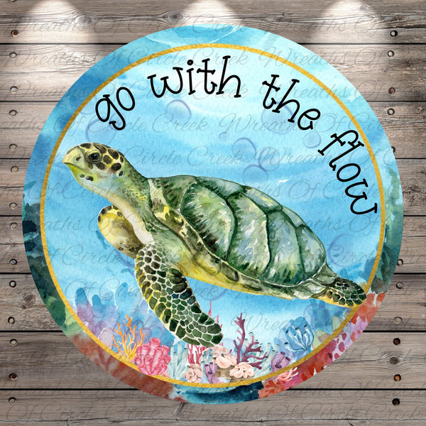 A watercolor painting of a green sea turtle swimming in the ocean, surrounded by colorful coral and marine life. The text "go with the flow" is written around the turtle, and the background is a blue watercolor with a white border.