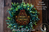 A festive Christmas wreath made of evergreen branches and adorned with a "Merry Christmas" sign, displayed on a wooden wall.