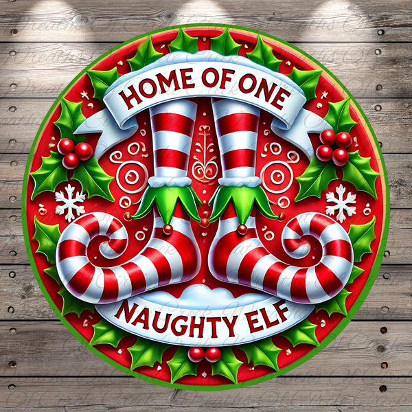 A festive circular design with a red and white striped ribbon, a pair of red and white striped boots, and the text &quot;HOME OF ONE&quot; and &quot;NAUGHTY ELF&quot; against a background of holly leaves and berries.