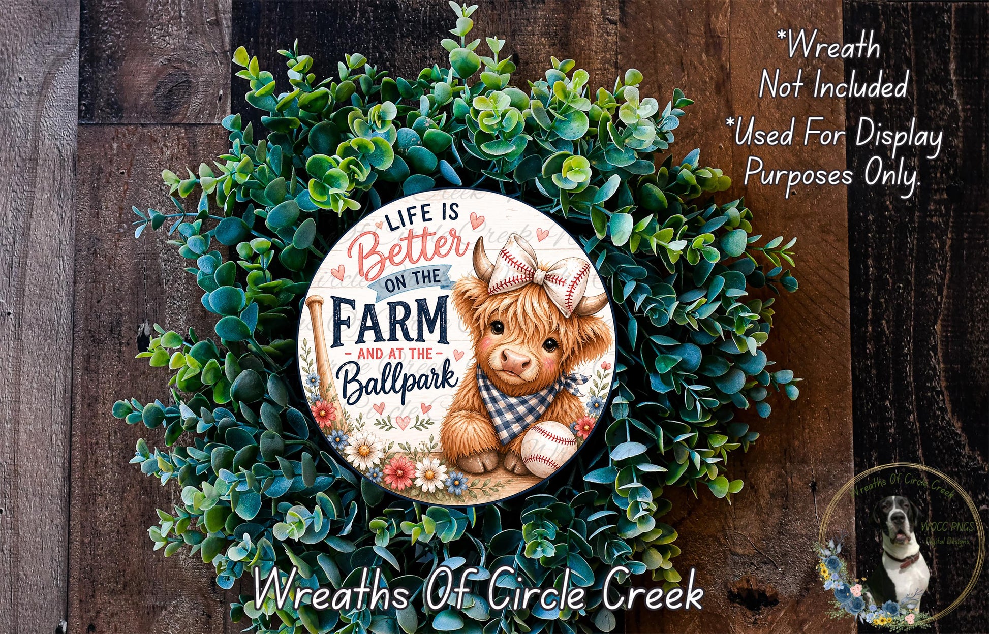 a wreath with a cow wearing a baseball cap and holding a baseball, surrounded by green foliage. The wreath is displayed on a wooden surface, and there is a text overlay that reads "Life is Better on the Farm at the Ballpark Wreaths of Circle Creek".