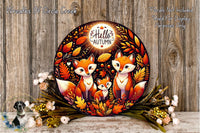 a decorative wreath with a central design of three foxes surrounded by autumn leaves and flowers. The wreath is placed on a wooden surface, and there are some flowers and leaves scattered around it.