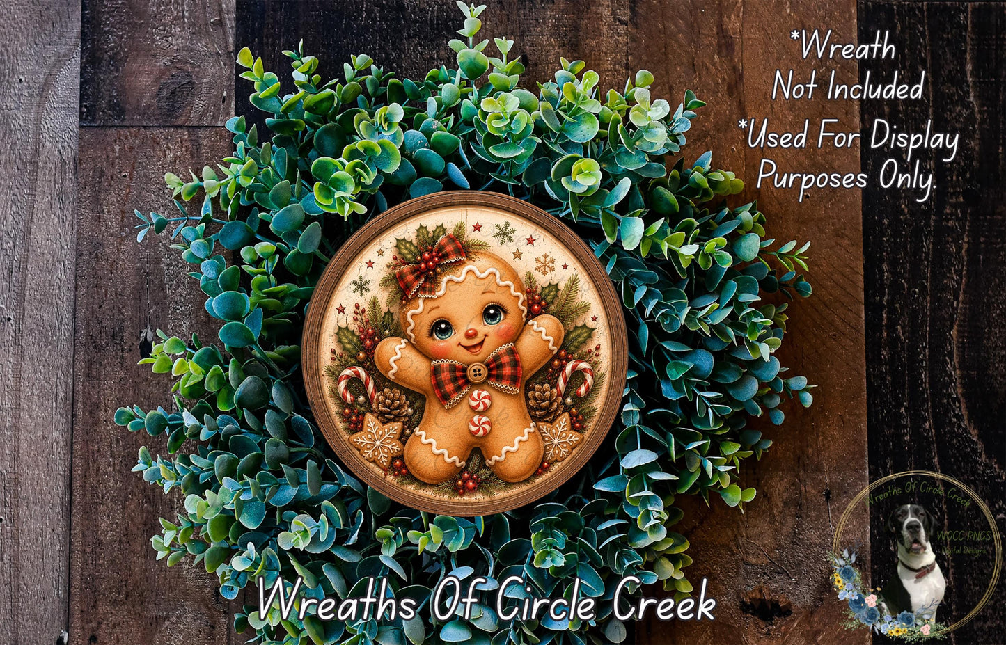 A wreath featuring a gingerbread man figure surrounded by greenery, with a caption stating that the wreath is not included in a display and is used for purposes only.