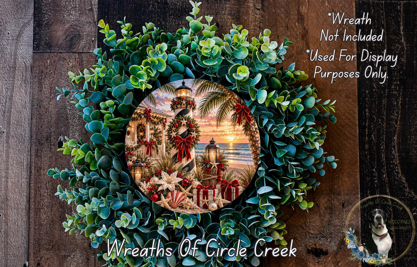 A wreath made of various greenery and flowers, with a circular frame containing a photograph of a lighthouse and a sunset.