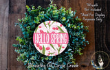 A wreath made of green leaves and pink flowers, with the text "Hello Spring" displayed on it.