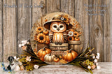 A decorative wreath featuring an owl wearing a hat and surrounded by autumn-themed elements such as pumpkins, flowers, and leaves.